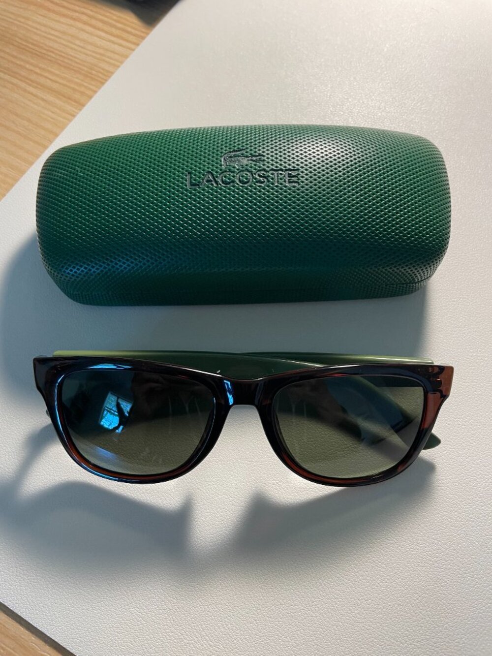 Lacoste L798S Sunglasses in tortoiseshell frame and green temples.